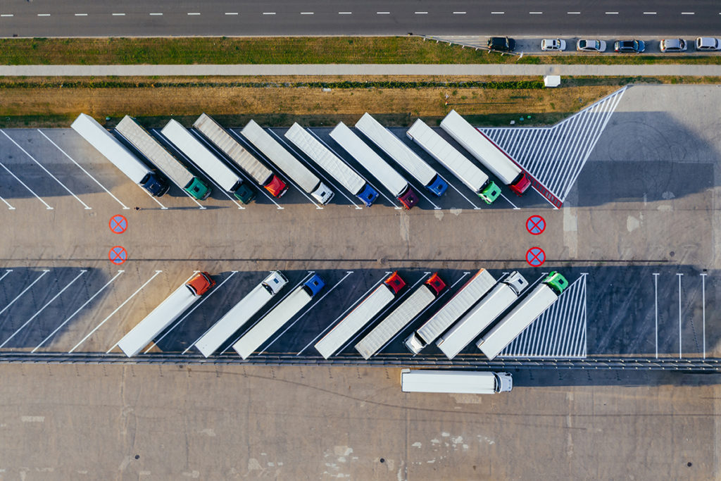 Parking lot with parked transport trucks